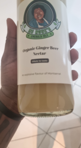 Hand holding ginger beer nectar